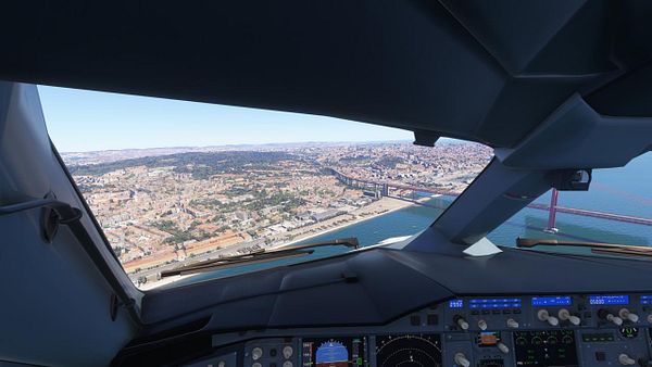 A cockpit view of an A380 flying over Lisbon, showcasing the cityscape and a prominent bridge.