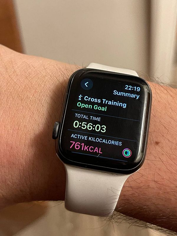 A smartwatch displays workout statistics for a cross-training session.