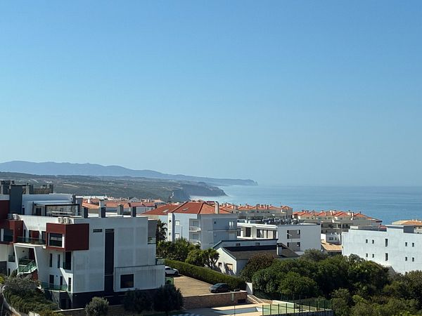 Scenic view of the sea and coastline from a seaside location in Ericeira during daytime.