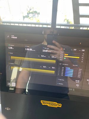 The image displays a fitness machine's screen showing workout statistics.