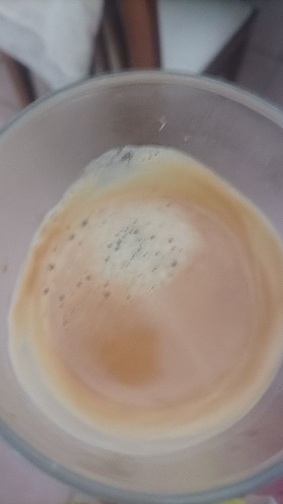 A close-up view of a glass containing espresso.
