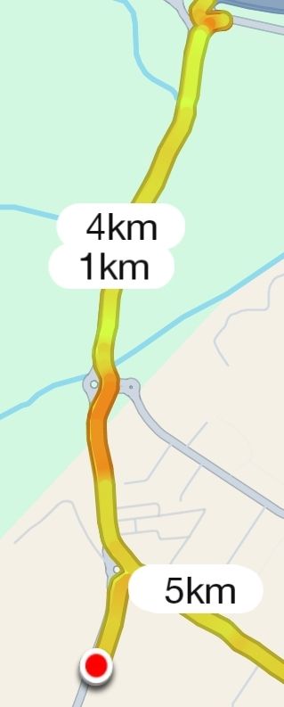 The image displays a map with a highlighted running route and distance markers.