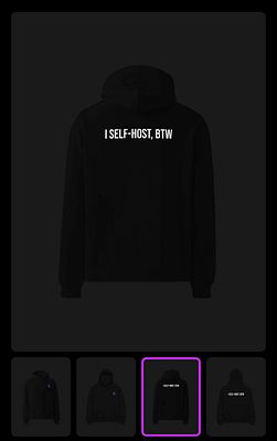 A black hoodie featuring the text 'I SELF-HOST, BTW' on the back.