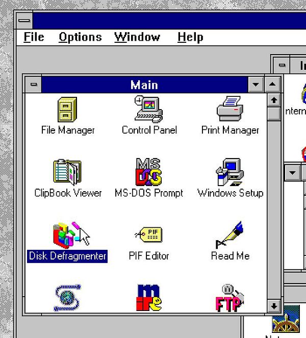 The image displays a Windows 3.11 interface featuring various system utilities.