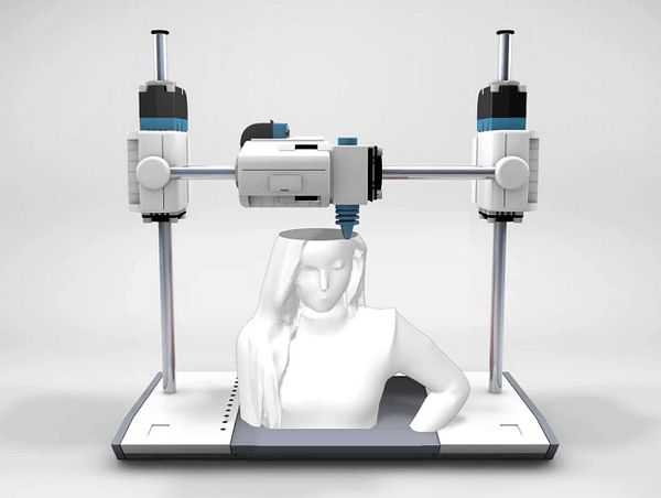 A 3D printer is in the process of creating a bust of a female figure.