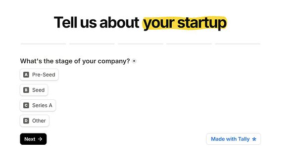 A tally form asking about the stage of a startup company with multiple choice options and a next button.