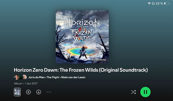 Black and white close-up photo of a person holding a camera, focusing on the camera lens and hand.