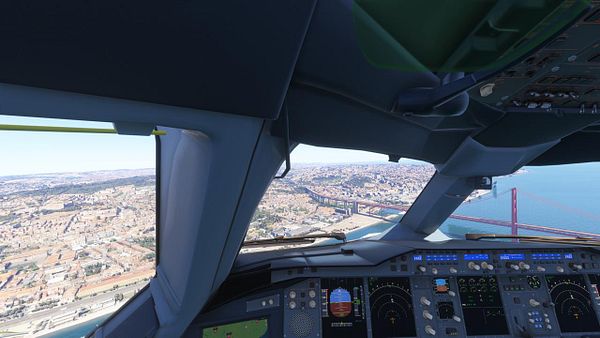A cockpit view of an A380 flying over Lisbon, showcasing the cityscape and a prominent bridge.