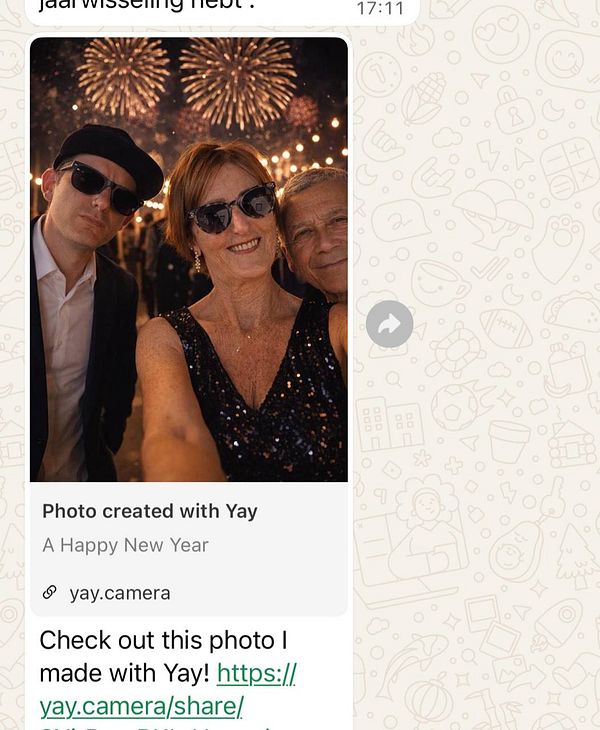 A festive selfie featuring three people with fireworks in the background.