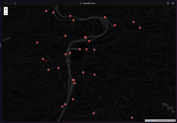 A dark-themed map of Prague displaying various bike-sharing locations marked with red squares.