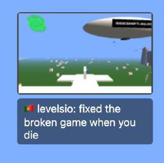 A 3D game scene featuring a blimp and various objects on the ground.