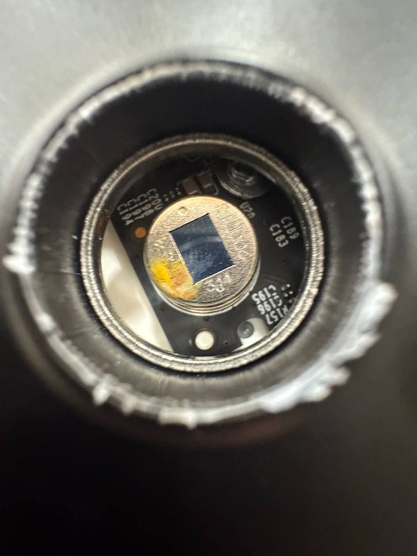 The image captures the interior of a Tapo Door Bell, showing damage caused by water exposure.