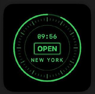 Close-up portrait of a young man with his hand resting on his head, wearing a greenish jacket against a neutral background.