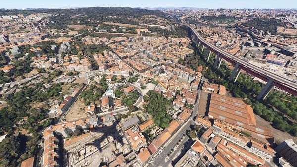 Aerial view of Lisbon showcasing urban architecture and infrastructure.