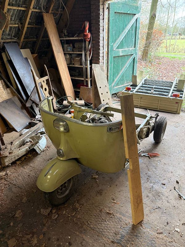 A workspace with woodworking tools and materials arranged for a DIY project.