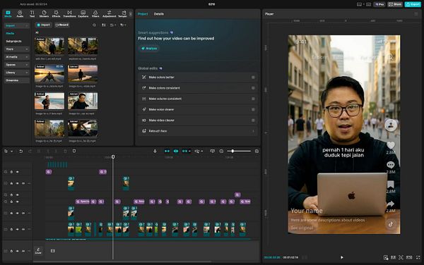 A man in a blue long-sleeve shirt and glasses is making expressive hand gestures while speaking into a microphone in a recording studio.