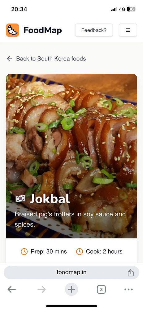 A vibrant dish of Jokbal, featuring braised pig's trotters garnished with green onions and sesame seeds.