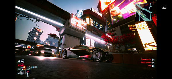 A futuristic cityscape featuring a sleek vehicle in a vibrant urban environment.