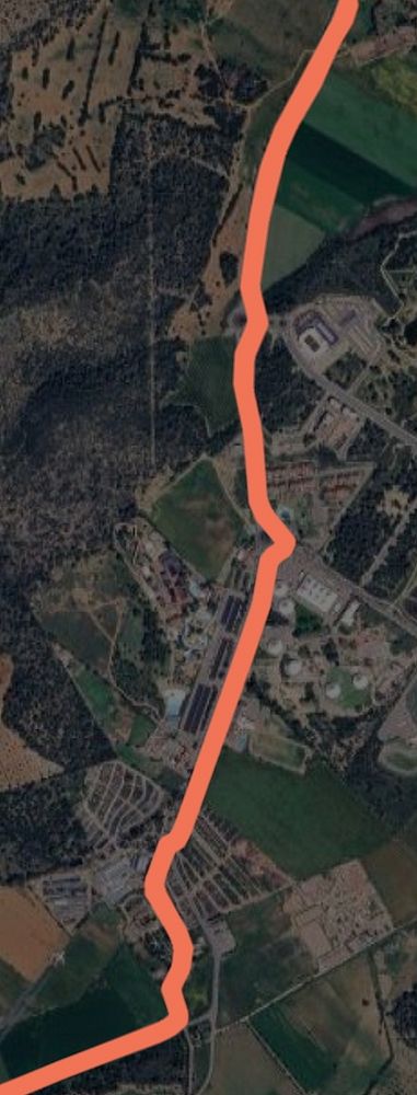 A digital sports watch displaying workout data with swim and run metrics.