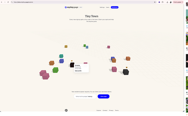 A colorful 3D isometric illustration of a tiny town featuring various buildings, roads, and greenery.