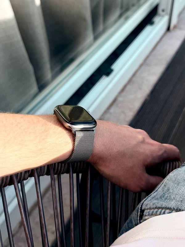 A close-up of an Apple Watch Series 7 in a vibrant green aluminum case with a matching green band.