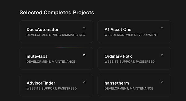 A workspace with multiple computer screens displaying a Windows 11 interface and graphic design work.