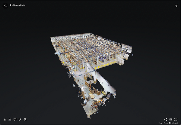A 3D scan of a warehouse interior showcasing storage racks and layout.