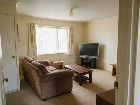 Before: A lived-in living room, before and after being emptied for a listing