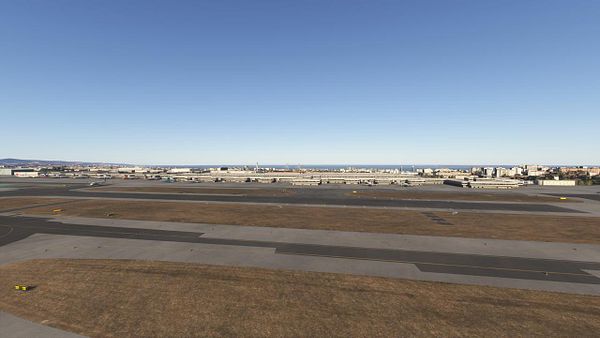 A panoramic view of an airport runway and surrounding area in a flight simulation environment.
