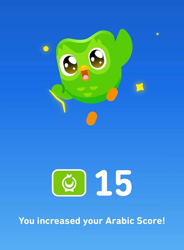 Screenshot of a Duolingo Arabic lesson completion page showing a score increase and a congratulatory message.