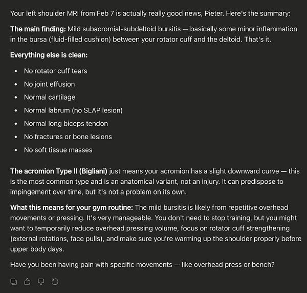 MRI scan image focusing on the left upper arm with visible muscle and bone structures.
