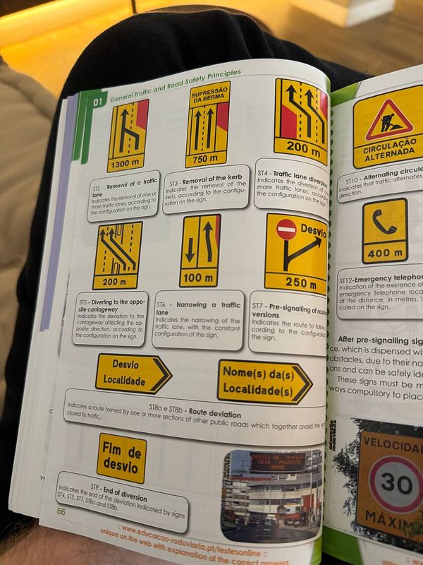 The image displays a page from a driving manual focused on traffic signs and road safety principles.