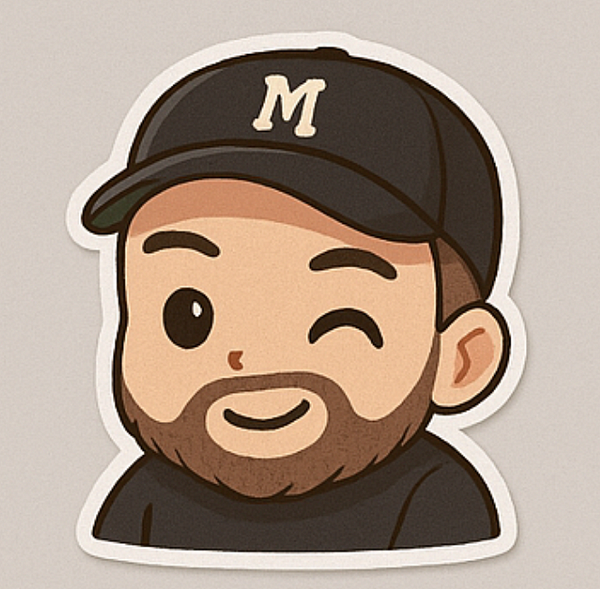 A cartoon-style sticker of a smiling character with a beard and a cap.