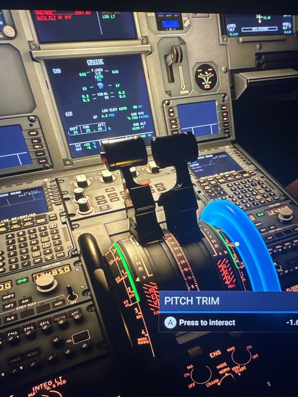 The image displays a close-up view of an aircraft cockpit control panel.