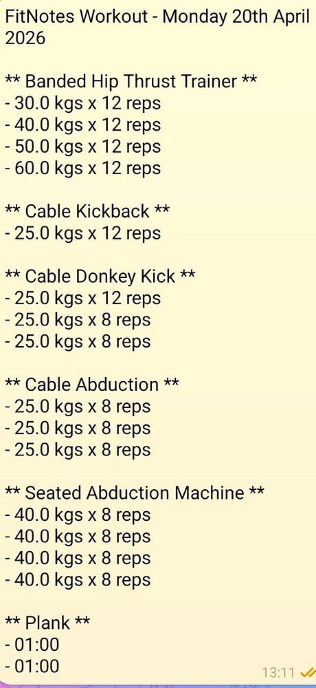 A well-equipped gym interior with various exercise machines and weights, featuring a modern, spacious layout and bright lighting.