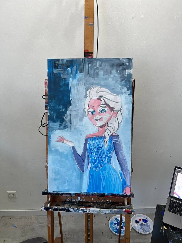 Acrylic painting of a character with blonde hair and a blue dress on an easel.