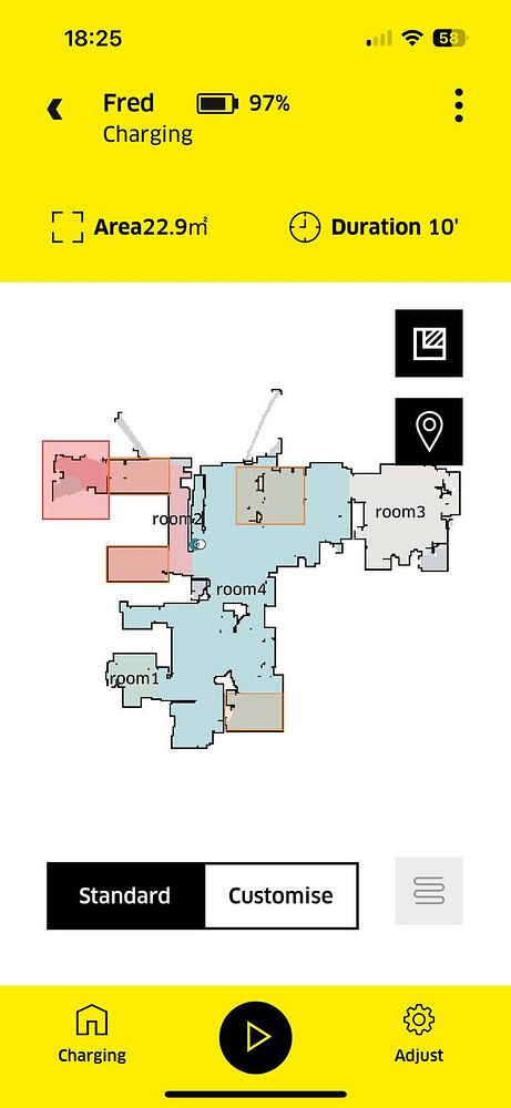 The image displays a smartphone interface for a robotic cleaner named 'Fred' showing its charging status and a map of the cleaned area.