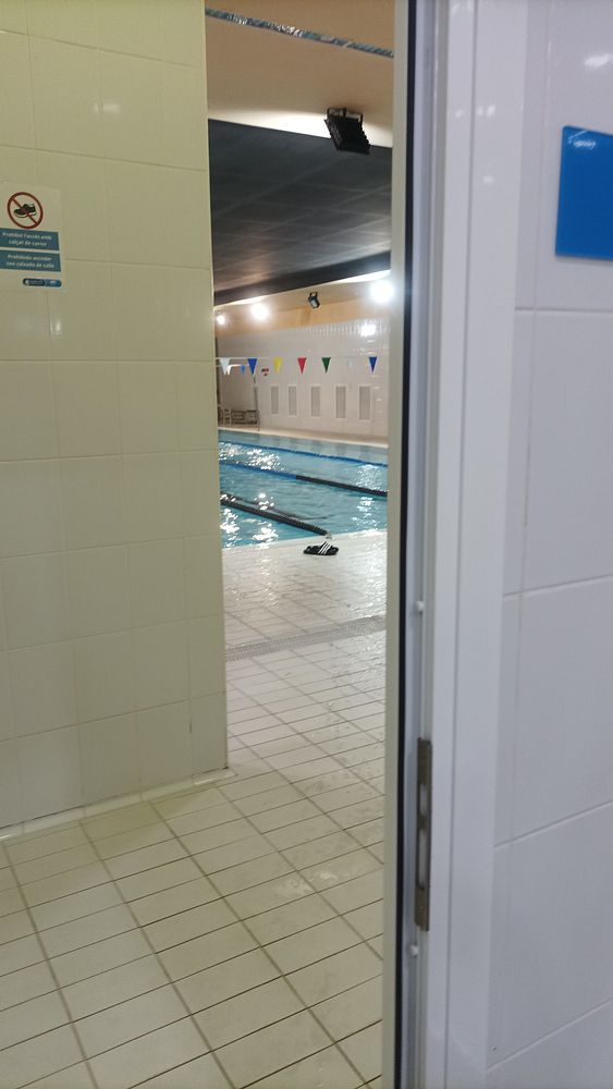 A smartphone screen showing a running app’s interface tracking a workout with time and distance metrics.