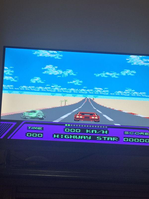 A young child is playing a Nintendo Entertainment System (NES) game on a vintage CRT television screen while holding a classic NES controller.