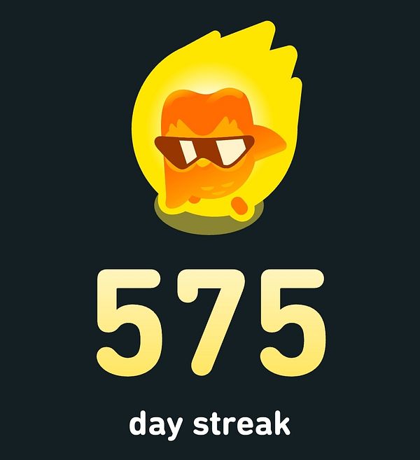 The image displays a vibrant badge indicating a 575-day streak.