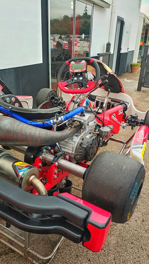 A close-up view of a go-kart showcasing its engine and components.