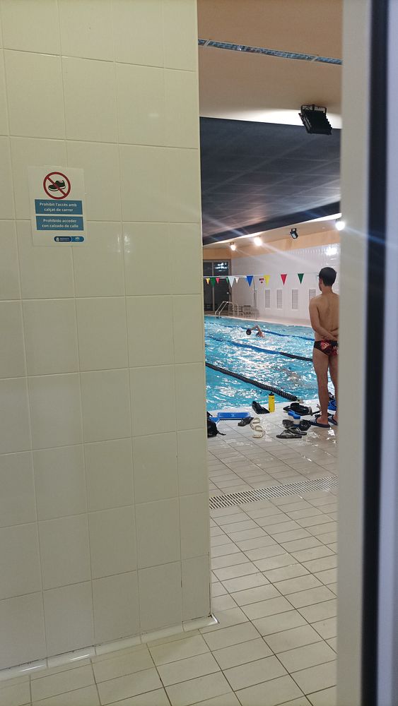 Black silhouette of a man running on circuit lines made of blue and purple light streaks.
