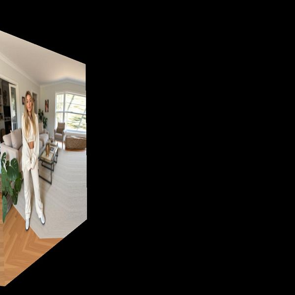 A woman stands in a stylish living room, captured in a cube map format.