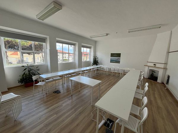 Spacious indoor venue with modern decor, good lighting, and multiple seating arrangements.