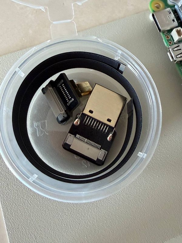 The image features a set of electronic connectors inside a transparent container.