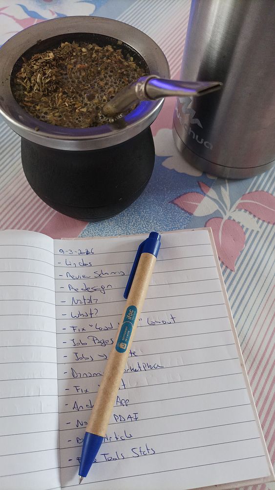 Photo of four people on a road with a pack of yerba mate and several bottles, symbolizing relaxation and daily tasks.