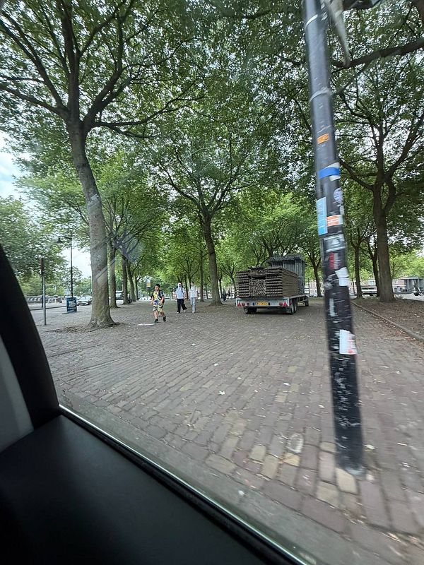 A series of 10 photographs capturing diverse neighborhoods and urban scenes in Rotterdam, highlighting changing demographics and cultural influences.