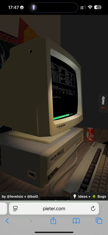 A vintage computer setup featuring a NEC PC-9801 with a CRT monitor displaying a command line interface.