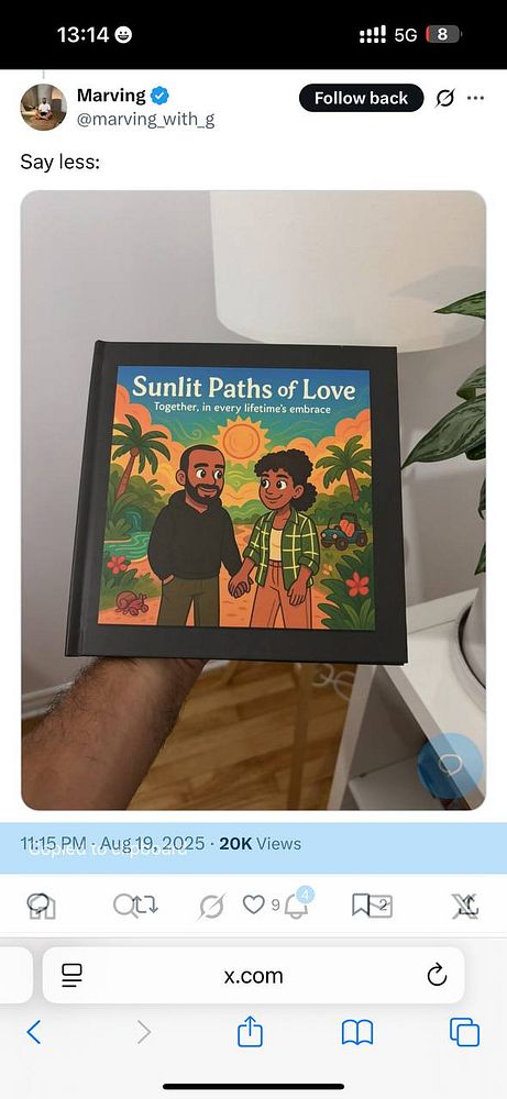 A person holds a colorful book titled 'Sunlit Paths of Love' featuring two animated characters in a vibrant setting.
