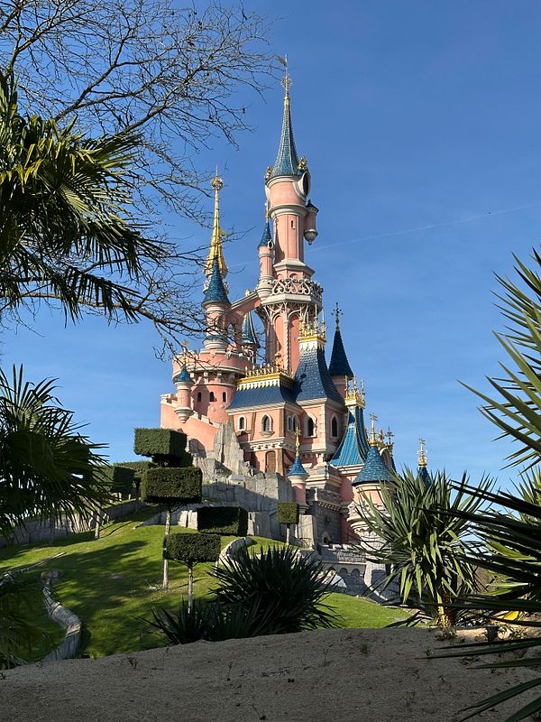 A picturesque view of the iconic Sleeping Beauty Castle at Disneyland Paris.